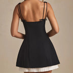 Black pleated A line mini skirt
