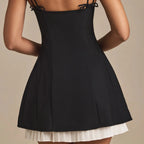Black pleated A line mini skirt
